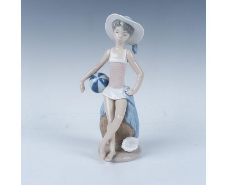 A glossy figure of a woman in summer attire, holding a beach ball and evoking a delightful summer feeling. This item has its 