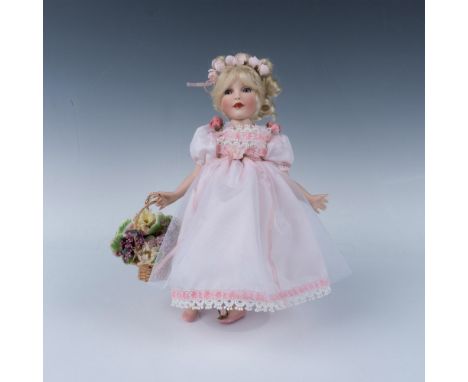 Part of the Treasury Collection this handcrafted, hand painted doll is lovely, dressed in satin and lace dress with floral ac