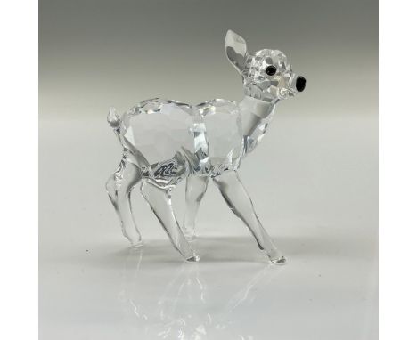 The fawn has a clear facetted body, smooth molded legs, and a black nose. Part of the Rare Encounters collection. Swarovski b