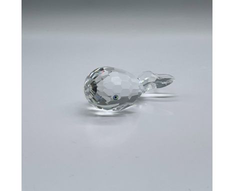 Sometimes known as Moby Dick or Smiley Whale. A clear faceted crystal figure with green-blue eyes and a frosted smirk. Swarov