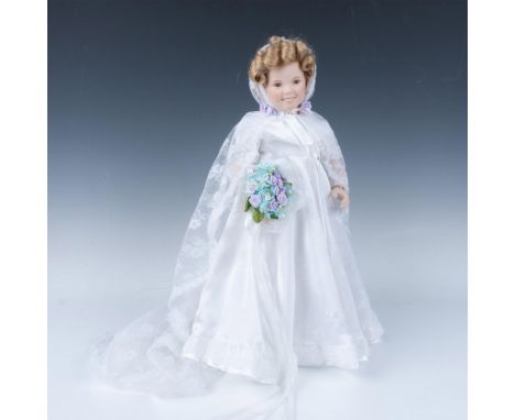 Hand painted portrait doll of bisque porcelain, highlighting her amazing blonde curly hair. Dressed in white satin and lace w