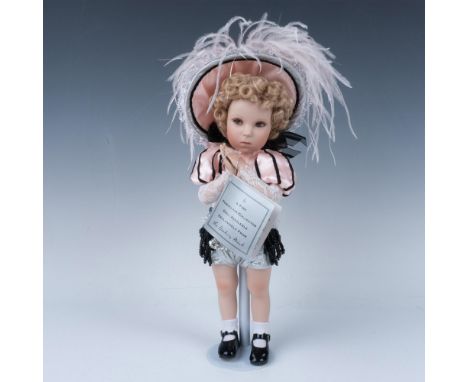 Doll was created as a nod to Shirley's first dancing role. Designed by artist noted. Hand painted with her curly blonde hair 