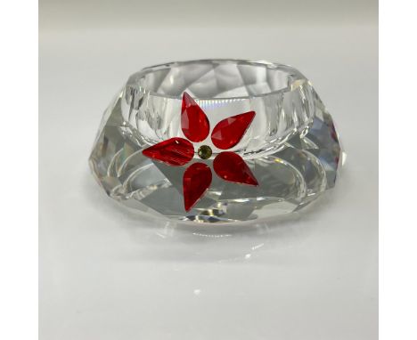 Part of the Christmas Home collection. A clear crystal candle holder decorated with facetted light Siam and topaz crystal to 