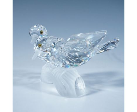 A clear faceted figure of two loving birds with iridescent eyes and frosted beaks and feet, perched on a frosted branch. 1989