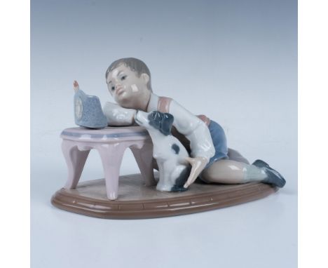 A glossy figure of a Jewish boy celebrating Hanukkah with his adorable dog in a peaceful moment. This item comes with its ori
