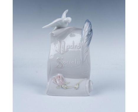 Glossy figure depicting a Lladro society on a paper plane with a dove, symbolizing peace and art. This item has its original 