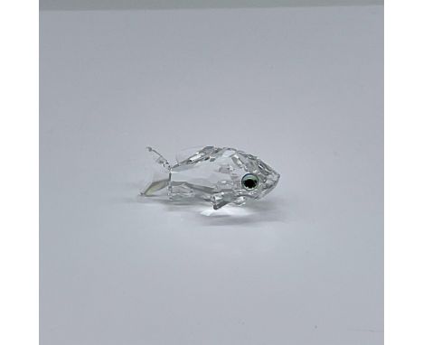 This retired fish figurine has a clear, facetted crystal body with blue/green eyes. Swarovski etched backstamp. This item has