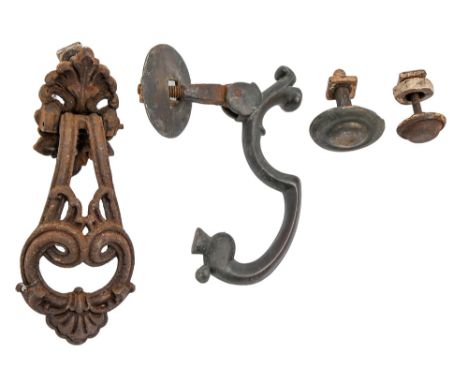 A Victorian brass door knocker and stud, 20cm h and a later Victorian ornate cast iron door knocker and stud (4)  The collect