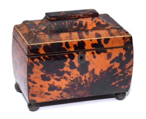 A Victorian tortoiseshell tea caddy, with pagoda lid and veneered in matched blond shell, the divided interior retaining pair