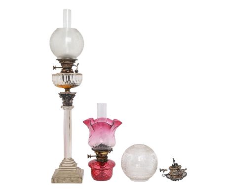 A Victorian brass mounted faceted glass columnar oil lamp, on stepped square foot, 54cm h, a contemporary oil lamp with cranb