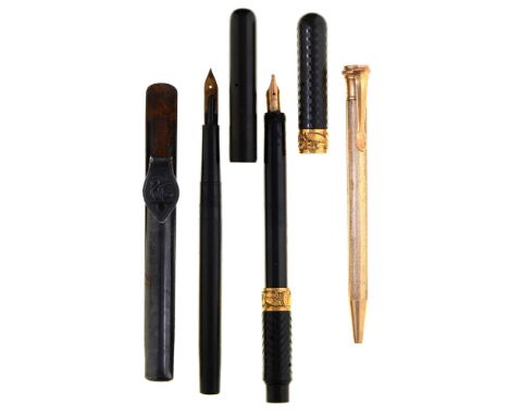 A Moore's non leakable vulcanite fountain pen, engine turned, with two embossed gold collars marked PAT DEC 29 1903, black ni