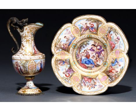 A Viennese enamel and gilt silver coloured metal miniature rosewater ewer and stand, c1900, the shield shape ewer with dragon