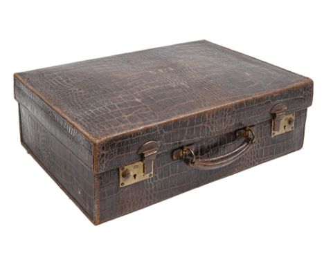 A crocodile hide dressing case, early 20th c, the lid lettered in gilt G F-J, brass lock, 35 x 51cm  The collection of C. W. 