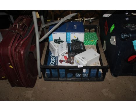 A box containing a pair of outdoor lights, various other lighting, a novelty toilet seat