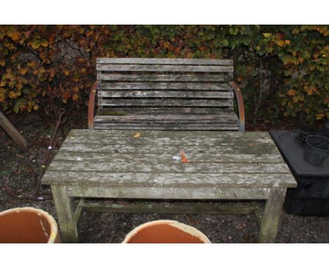 A wooden slatted bench and similar table 