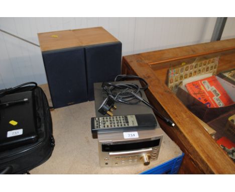 A TEAC Cd tuner/amplifier and two speakers