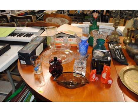 A collection of table glass ware to include engraved glass plate, Art Glass vases, Langham paperweights, table lighter, a Wed