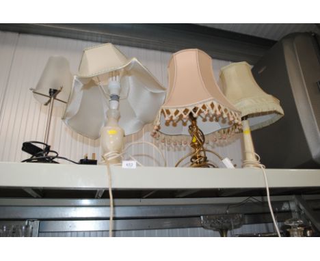 A brass table lamp and three others
