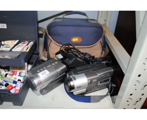 A Sony Camcorder together with a Canon Camcorder, battery charger and bag