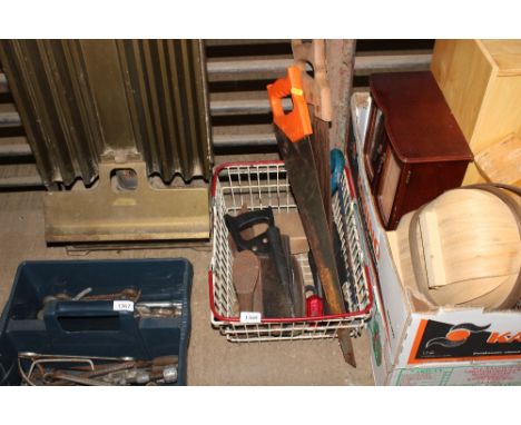 A shopping basket and contents of various hand tools 