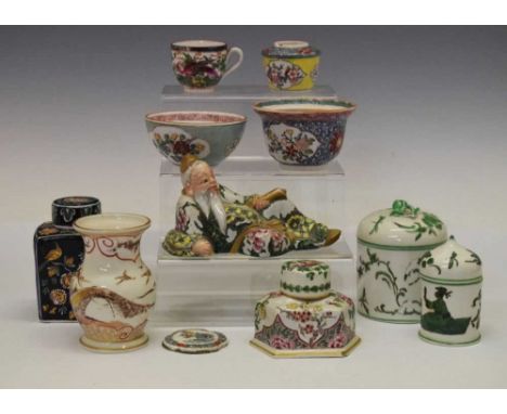 Group of French polychrome ceramics in the Chinese taste, to include reclining deity, black faience caddy, etc., 11cm high