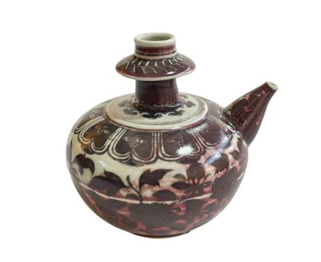 Chinese pottery ewer with flower and leaf design.