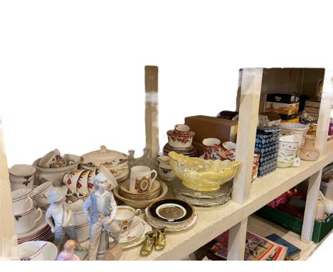 Full shelf of china, tea and dinnerwares, mantel clock, records, glass, etc.