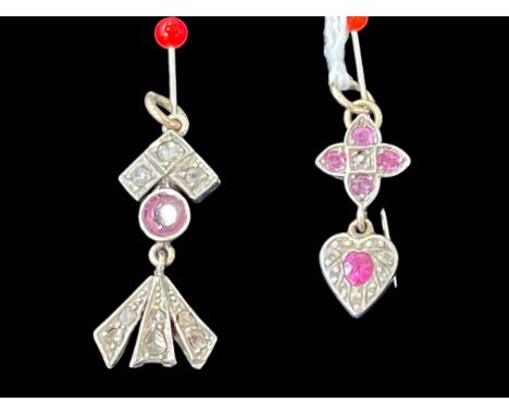 Two small diamond and ruby set pendants.