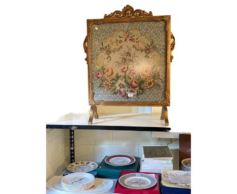 Gilt framed needlework firescreen and collection of decorative plates.