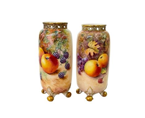 Pair of Royal Worcester fruit painted vases, signed J Reed and C Brown, both having gilded pierced rims and scroll feet, 14cm