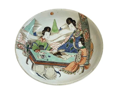 Chinese pottery circular dish decorated with geisha at a coffee table admiring a shanshui scroll, the base with a leaf motif 