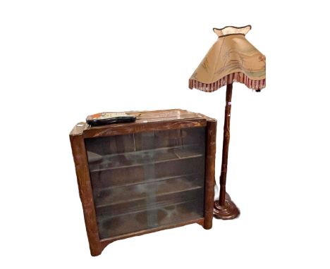 Oriental carved sliding glazed door bookcase and similar standard lamp and shade (2).