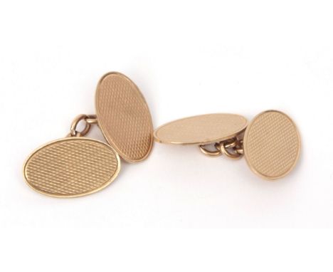 Pair of 9ct stamped oval cuff links, engine turned decoration, chain connectors, sponsor's mark DF, 7.6gms  