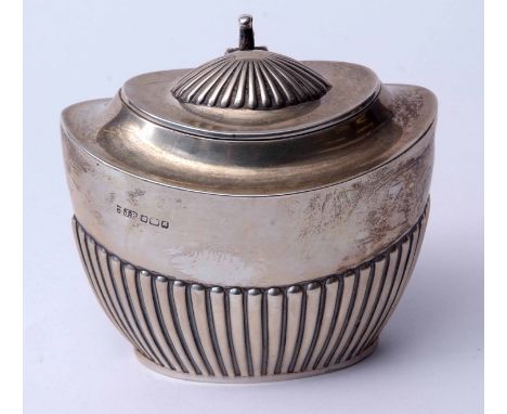 Edward VII oval tea caddy of half fluted oval form with hinged cover and cast and applied scrolling thumb piece, width 11cms,