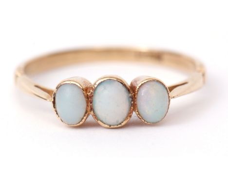 Three-stone opal ring, featuring three graduated cabochon opals in rub-over settings with pierced shoulders, stamped 18ct, si