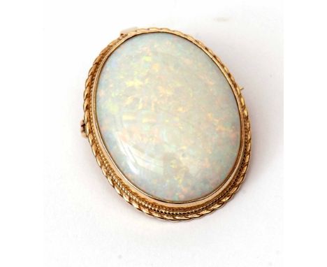 9ct gold and opal pendant brooch, the oval shaped cabochon opal framed in a hallmarked gold mount (Birmingham 1982), 30 x 22m