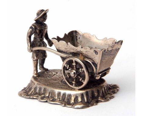 Late 19th century Dutch model of a gardener with a large wheelbarrow on a shaped oval base, length 6 1/2 cms, weight approx 6