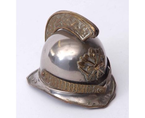 Late 19th century base metal table vesta case modelled in the form of a fireman's helmet with hinged top and internal mounted