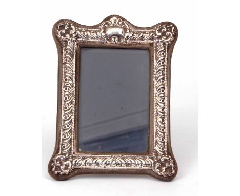 Elizabeth II silver mounted easel backed photograph frame, the applied gadrooned mount with foliate corners and vacant cartou