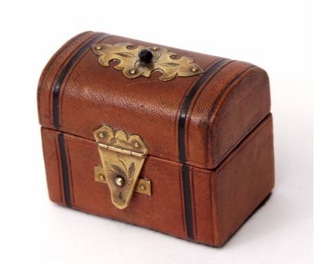 Late 19th century perfume bottle case, the morocco covered case modelled in the form of a travelling trunk with folding brass