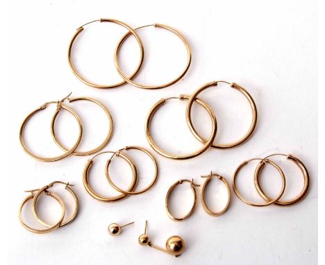 Mixed Lot: 7 pairs of 9ct gold hoop earrings and two odd 9ct ball finial earrings, 12.3gms gross weight  