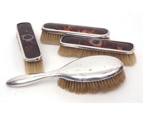 Mixed Lot: pair of silver mounted and tortoiseshell clothes brushes, together with a further single example and a silver back