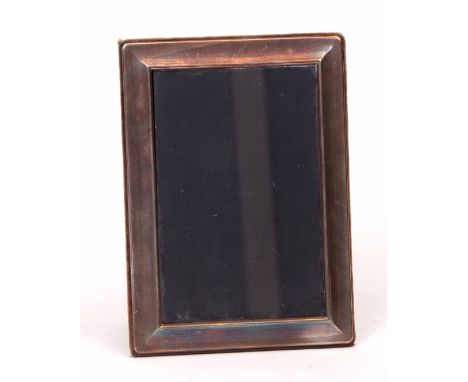 Elizabeth II silver mounted easel backed photograph frame, the plain and polished rectangular mount to a fabric covered frame