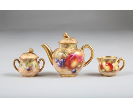 Royal Worcester miniature three piece tea service, teapot, sugar and cream, decorated with hand painted fruit. Signed Freeman