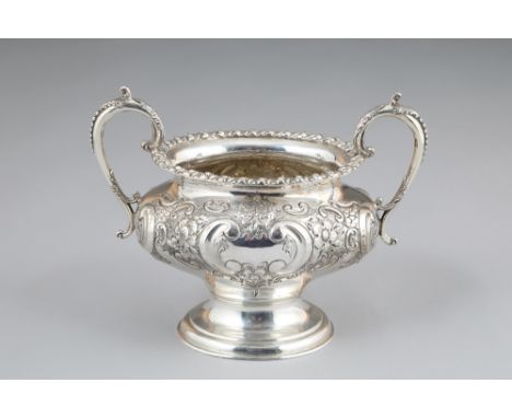 Victorian silver twin handled sugar basin, acanthus leaf capped scroll handles, embossed scroll and floral decoration.  Assay