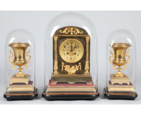 19th Century French brass eight day mantel clock, with a pair of matching clock garnitures, gilt dial, black numerals, applie