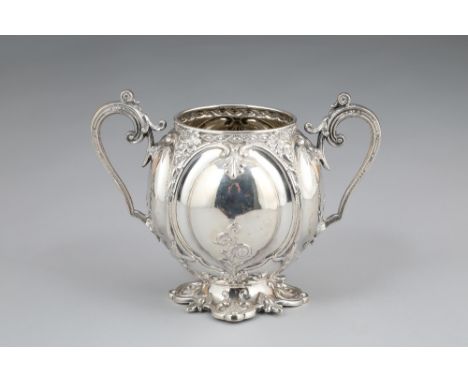 Victorian silver double handled sugar basin, embossed decoration twin scroll handles raised on a shaped base.  Assay marked S