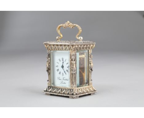 Silver cased carriage clock by Charles Frodsham, London white dial with Roman numerals, bevelled glass, scroll swing handle w