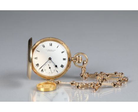 Gents 18 carat gold Hunter pocket watch with 9 carat gold watch chain and fob. White dial with Roman numerals and subsidiary 
