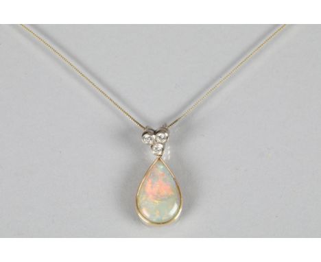 18 carat opal and diamond pendant, teardrop opal below a cluster of 3 small diamonds on a thin 9 carat gold chain